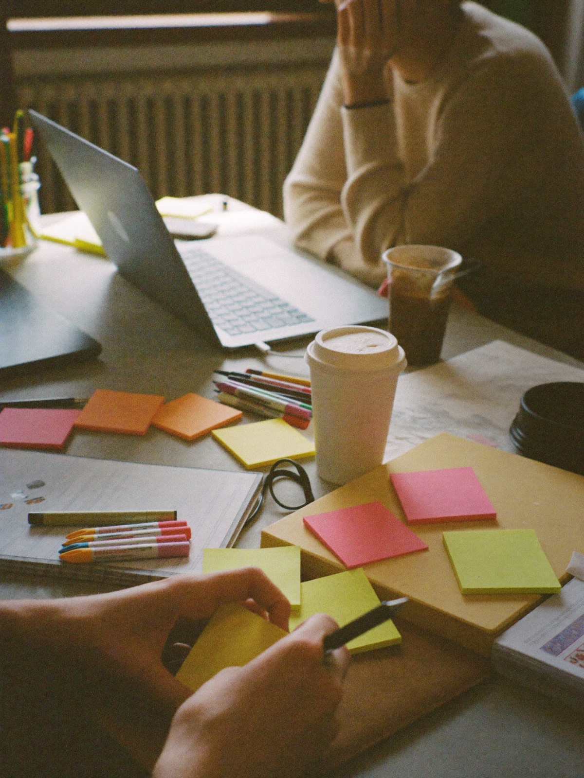 A table mid-session, covered in sticky notes and markers